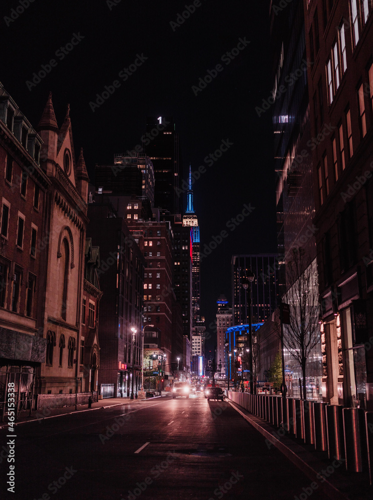 street New York city at night cars lights skyscrapers buildings traffic urban