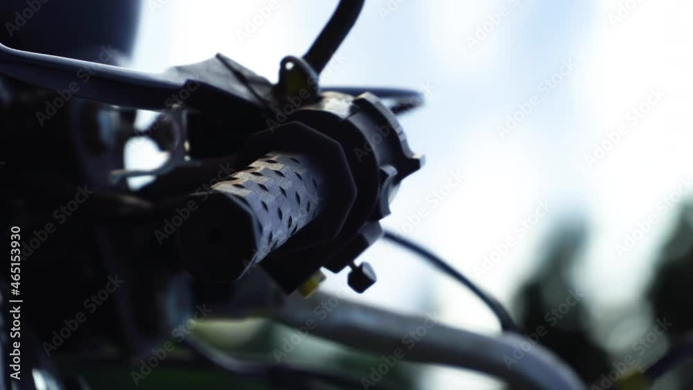 Close Up Of Side Mirror, Hand Brake, And Throttle Of A Motorcycle. slider down Close Up Of Side Mirror, Hand Brake, And Throttle Of A Motorcycle. slider down