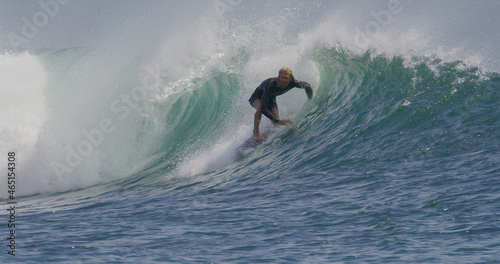 Surfer surfing riding a small barrel tube © blvdone