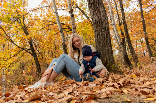 Mom and son are playing outdoors in the forest. Concept family pastime.