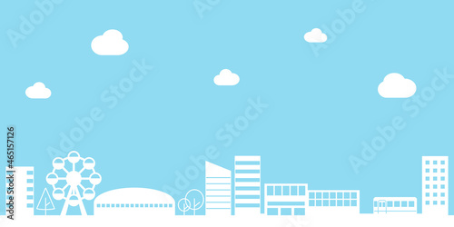 都会の街並みと入道雲