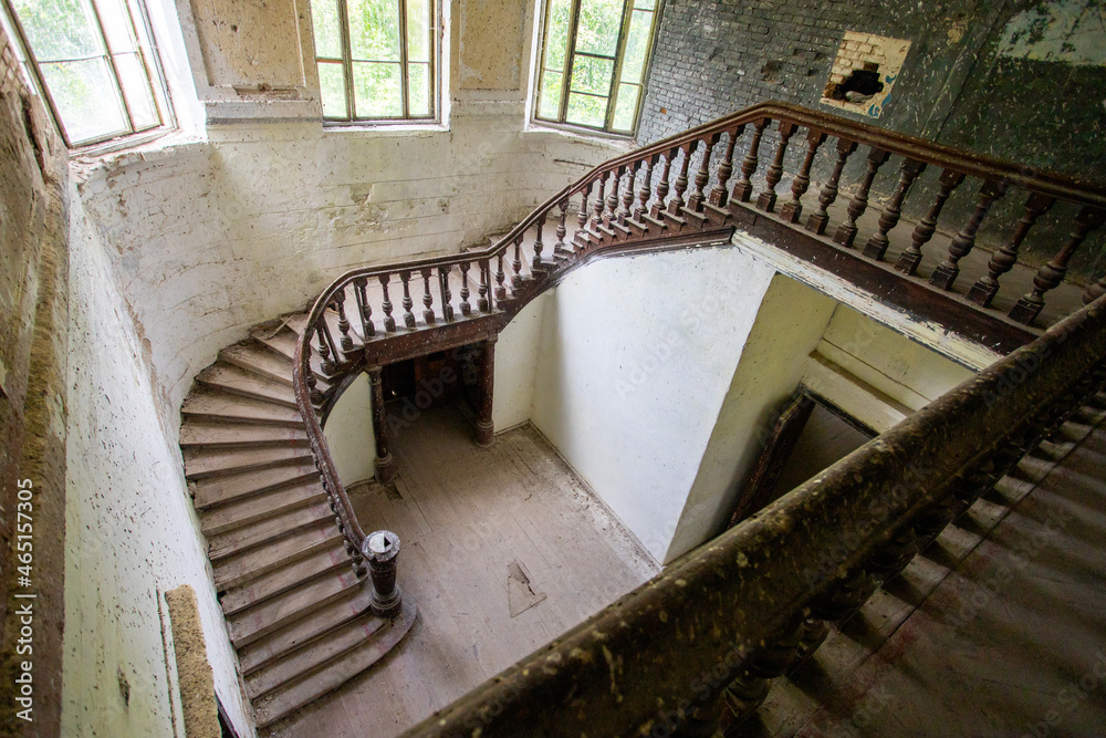 Top view of the wooden staircase in an old castle in light colors. High quality photo