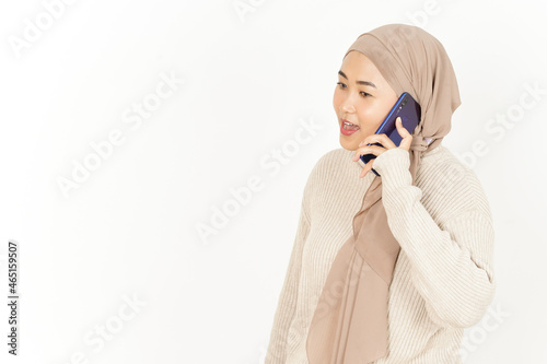 Talking on the phone of Beautiful Asian Woman Wearing Hijab Isolated On White Background