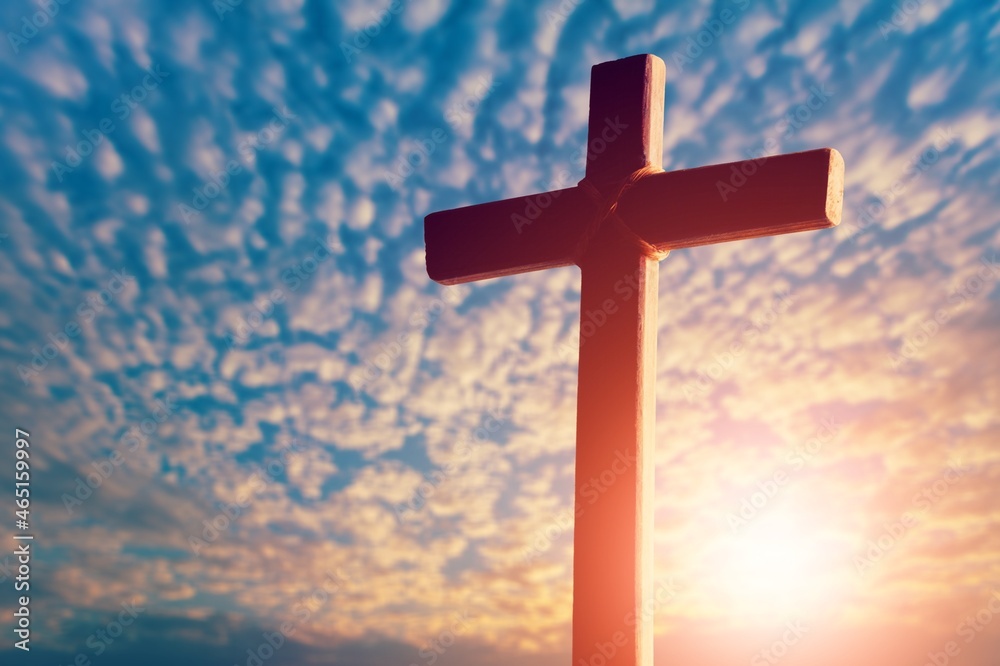 Wooden cross at sunset, crucifixion of Jesus Christ Wooden cross at sunset, crucifixion of Jesus Christ