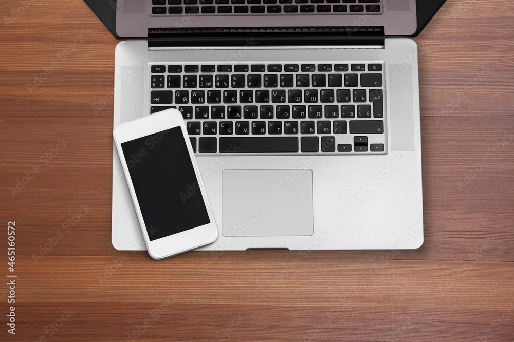 Modern office desk with a smartphone, laptop Modern office desk with a smartphone, laptop