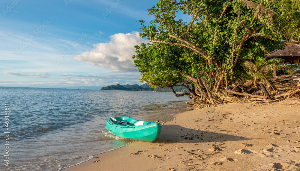 Green kayak on a beach at Koh Chang island in Thailand Green kayak on a beach at Koh Chang island in Thailand