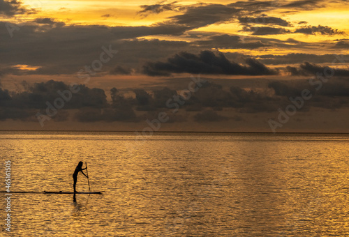 Stand-up paddle board rider at sunset off the coast of Koh Chang island in Thailand © Rex Wholster