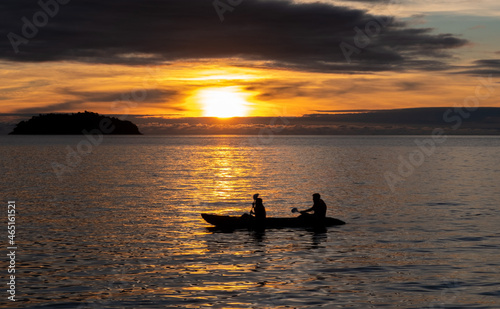 Kayakers at sunset in the sea at Koh Chang island in the Gulf of Thailand