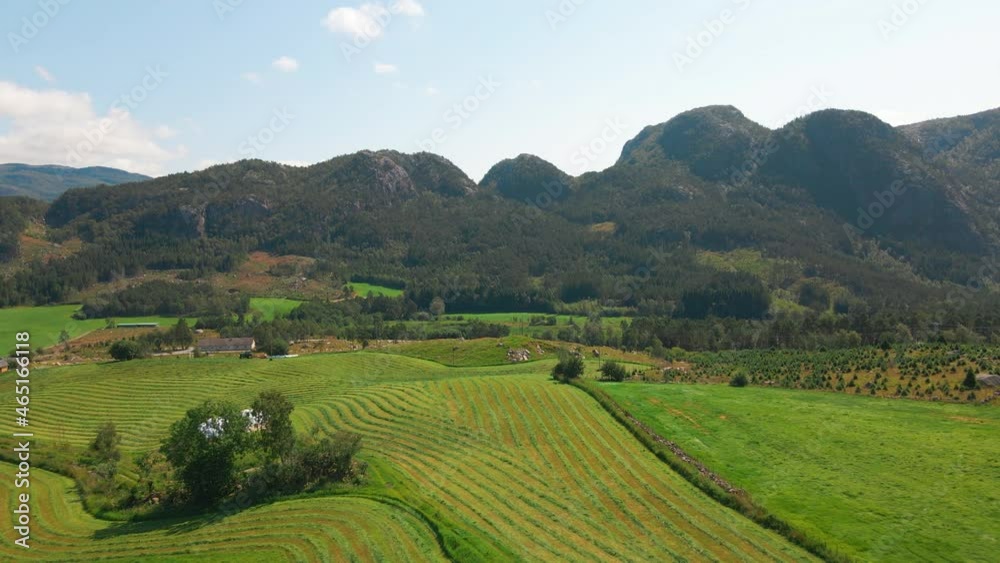 Beautiful aerial shot flying over farmland and fields in Rogaland, Norway Beautiful aerial shot flying over farmland and fields in Rogaland, Norway