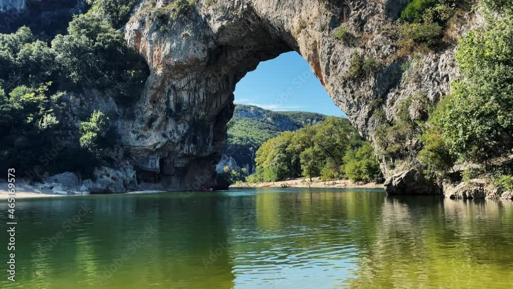 Watersport and Tourism. People kayaking on famous river in front of cliffs vallon pont d'arc in Ardeche in France. Watersport and Tourism. People kayaking on famous river in front of cliffs vallon pont d'arc in Ardeche in France.