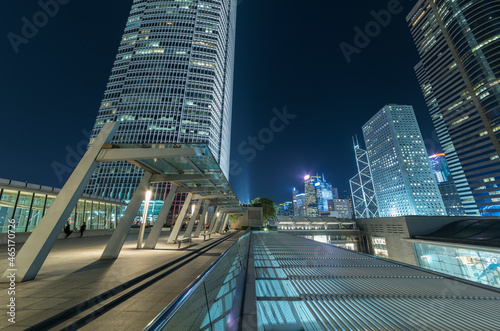 Modern office building and skyline of Hong Kong city at night © leeyiutung