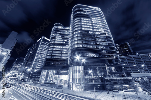 Modern office building in downtown of Hong Kong city at night