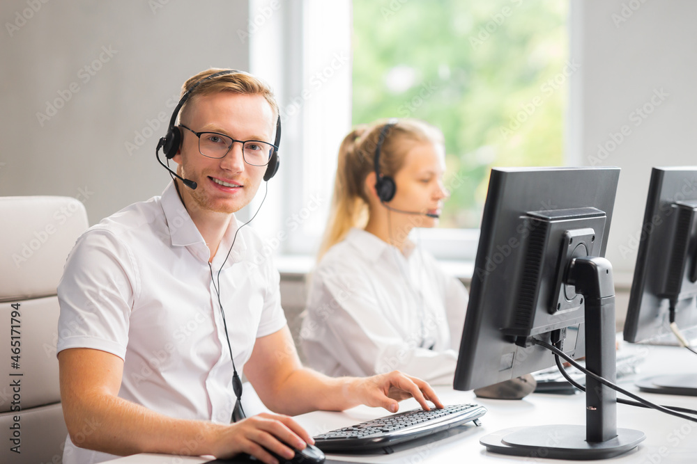 Diverse team of young professionals is working in the phone support office. Working day of sales managers in the call center. Business, telephone consulting and problem solving. Diverse team of young professionals is working in the phone support office. Working day of sales managers in the call center. Business, telephone consulting and problem solving.
