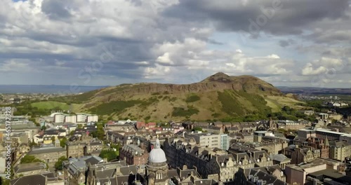 Beautiful drone footage above Edinburgh Scotland on a stunning summer day. Blue skies over high road, edinburgh castle, aurthur's seat and the entire city. rare, new footage, 4k gradable. photo