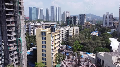 drone footage of india mumbai goregaon bird's eye view of green city and under construction building's photo