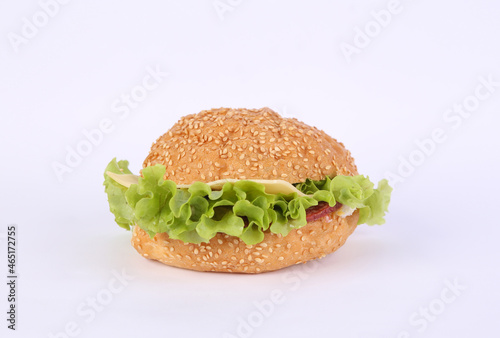 Homemade burger with lettuce on a white background