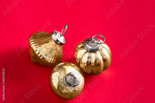 Three vintage Christmas balls; on red background.Meryy Christmas concept. Copy space photo