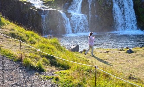 Kirkjufell, Iceland on August 7, 2021 - Foreign tourists ignoring the boundaries set by the Icelandic people, crossing lines and meanwhile destorying nature photo