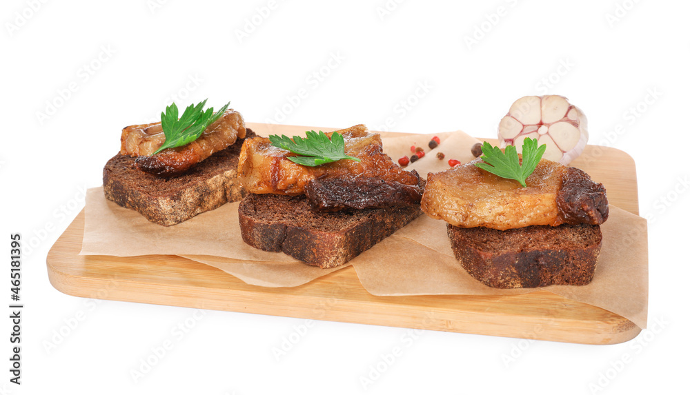 Rye bread with tasty fried cracklings and parsley on white background. Cooked pork lard Rye bread with tasty fried cracklings and parsley on white background. Cooked pork lard