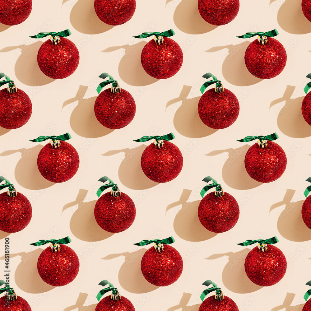 Happy holidays, Merry Christmas, New Year seamless pattern. Sparkling shiny red Christmas balls, new year design with shadows on pastel pink Happy holidays, Merry Christmas, New Year seamless pattern. Sparkling shiny red Christmas balls, new year design with shadows on pastel pink
