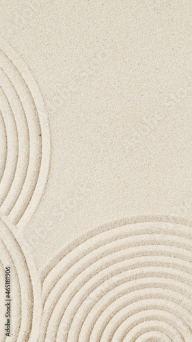 Lines drawing on sand, beautiful sandy texture. Spa background, minimal concept