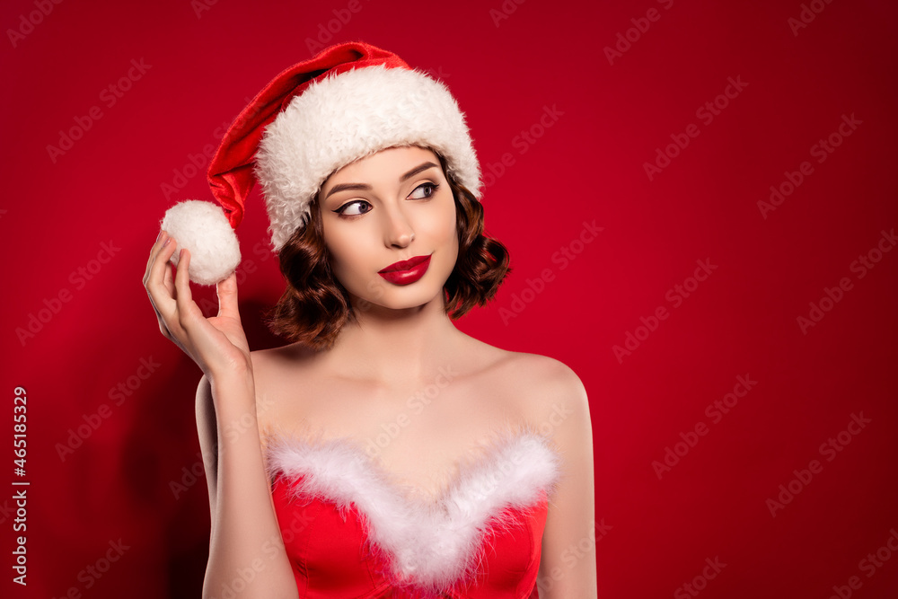 Photo of dreamy cool happy lady look empty space hold ball hat christmas eve isolated on gradient red color background Photo of dreamy cool happy lady look empty space hold ball hat christmas eve isolated on gradient red color background