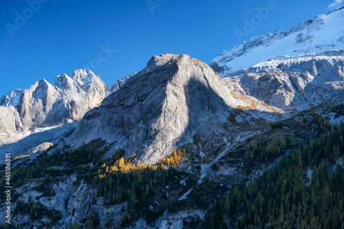 High sharp rocks and forest. Mountain valley before sunset. Natural landscape...