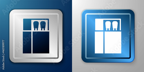 White Open matchbox and matches icon isolated on blue and grey background. Silver and blue square button. Vector