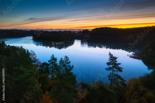 Aerial landscape of beautiful lake and a forest in Kashubia at sunrise. Poland