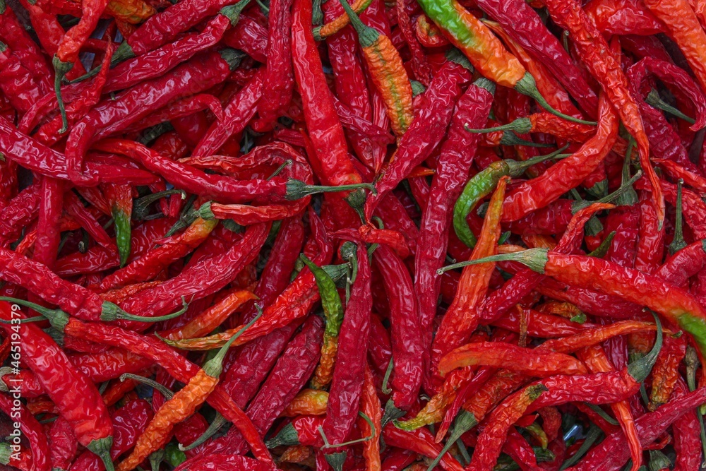 dried green chilli and peppers turns into red colour top view, selective focus dried green chilli and peppers turns into red colour top view, selective focus