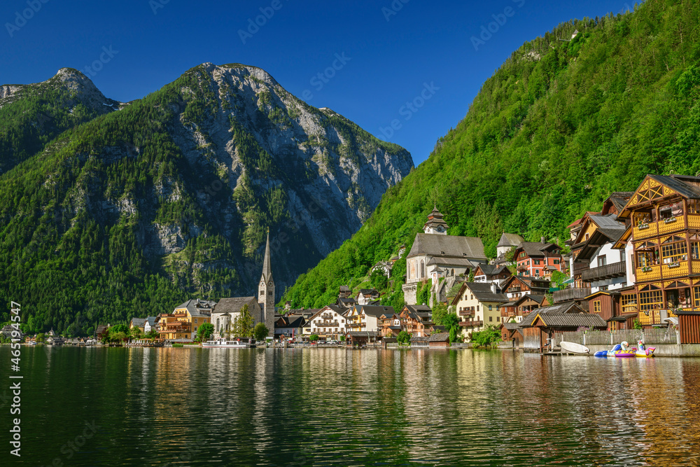Scenic view of lake by Hallstatt town against clear sky Scenic view of lake by Hallstatt town against clear sky