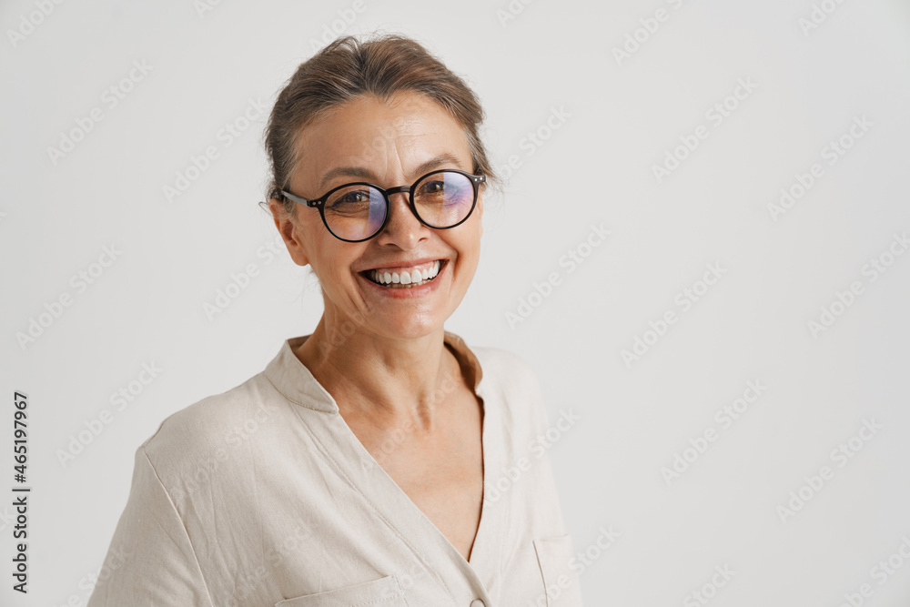 European mid woman in eyeglasses smiling and looking at camera European mid woman in eyeglasses smiling and looking at camera