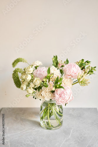 Beautiful flower arrangement in a glass vase. Flowers bunch, set for interior. Fresh cut flowers for decoration home. European floral shop. Delivery fresh cut flower.v