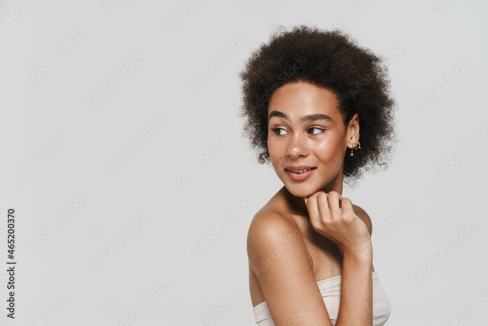 Black brunette woman smiling and looking at camera Black brunette woman smiling and looking at camera
