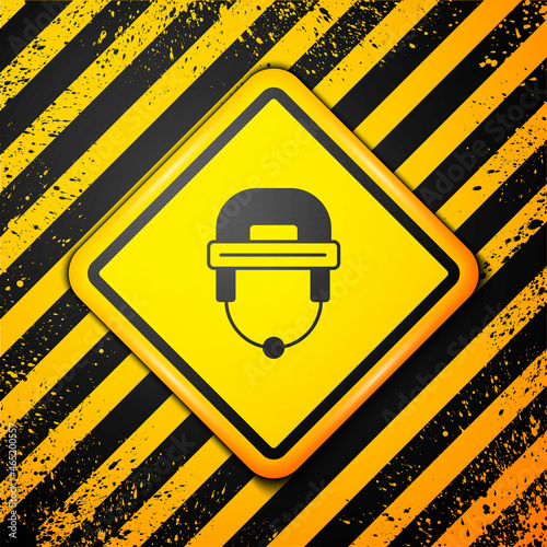 Photography Black Hockey helmet icon isolated on yellow background