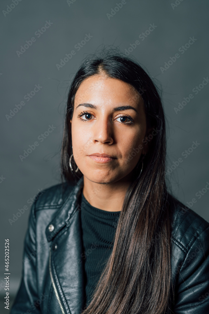 Young woman in front of gray background Young woman in front of gray background