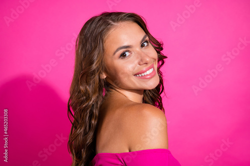Profile side view portrait of attractive cheerful wavy-haired girl posing copy space isolated over bright pink color background