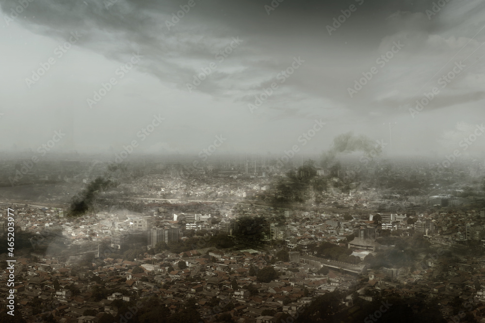 Fototapeta premium Dramatic view of cityscape with dark cloudscapes