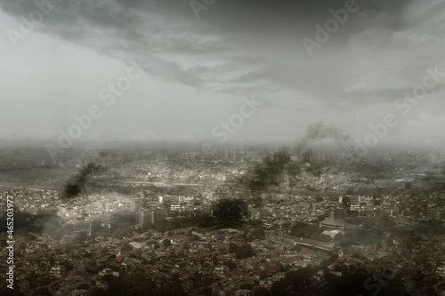 Dramatic view of cityscape with dark cloudscapes