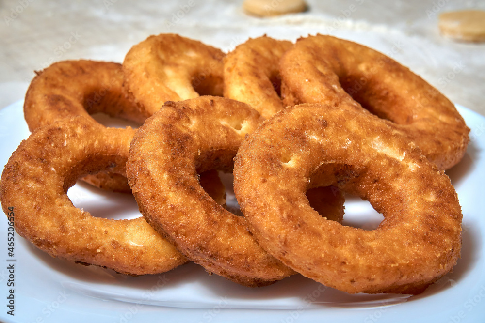 Fried curd donuts in a plate close-up