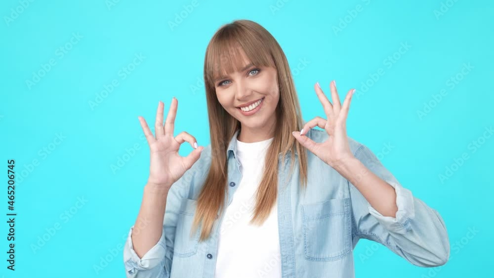 Cheerful reliable lady raise hands show two okey signs Cheerful reliable lady raise hands show two okey signs
