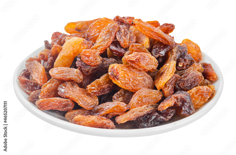Golden dried raisins in white plate isolated on white background.