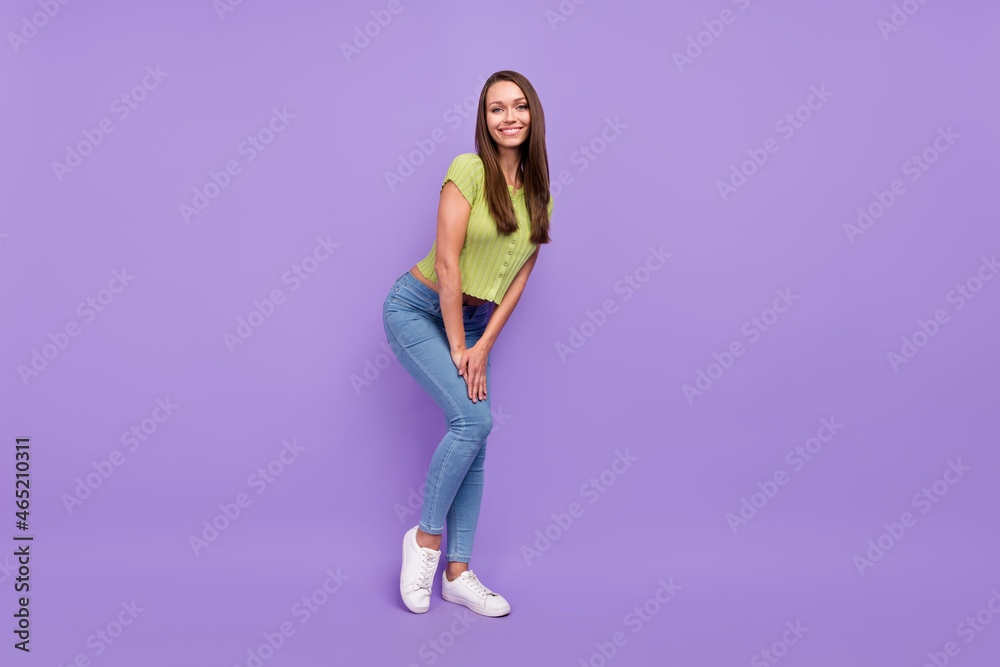 Full length body size view of attractive cheerful girl posing good mood isolated over purple violet color background Full length body size view of attractive cheerful girl posing good mood isolated over purple violet color background