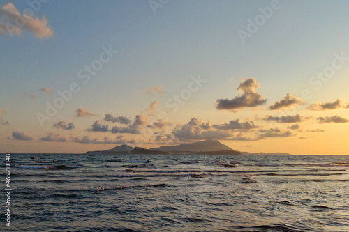 Beatiful sunset of ending summer on the Naples Coast  Procida and Ischia Islands on background