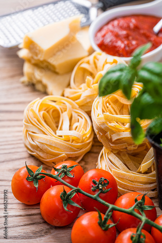 raw bolognese pasta with ingredients traditional italian recipe