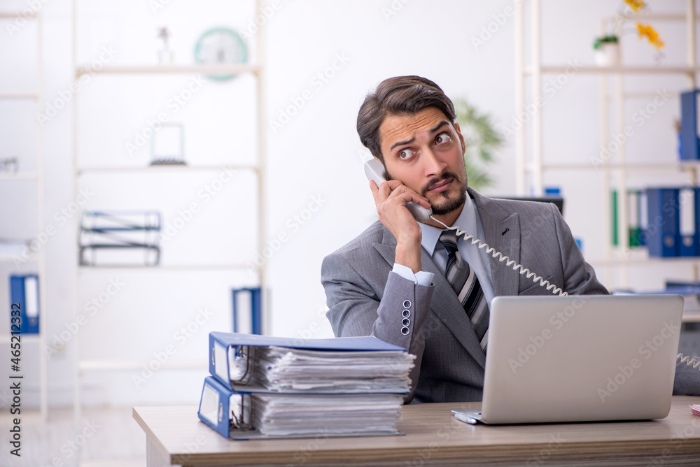 Young businessman employee working in the office Young businessman employee working in the office