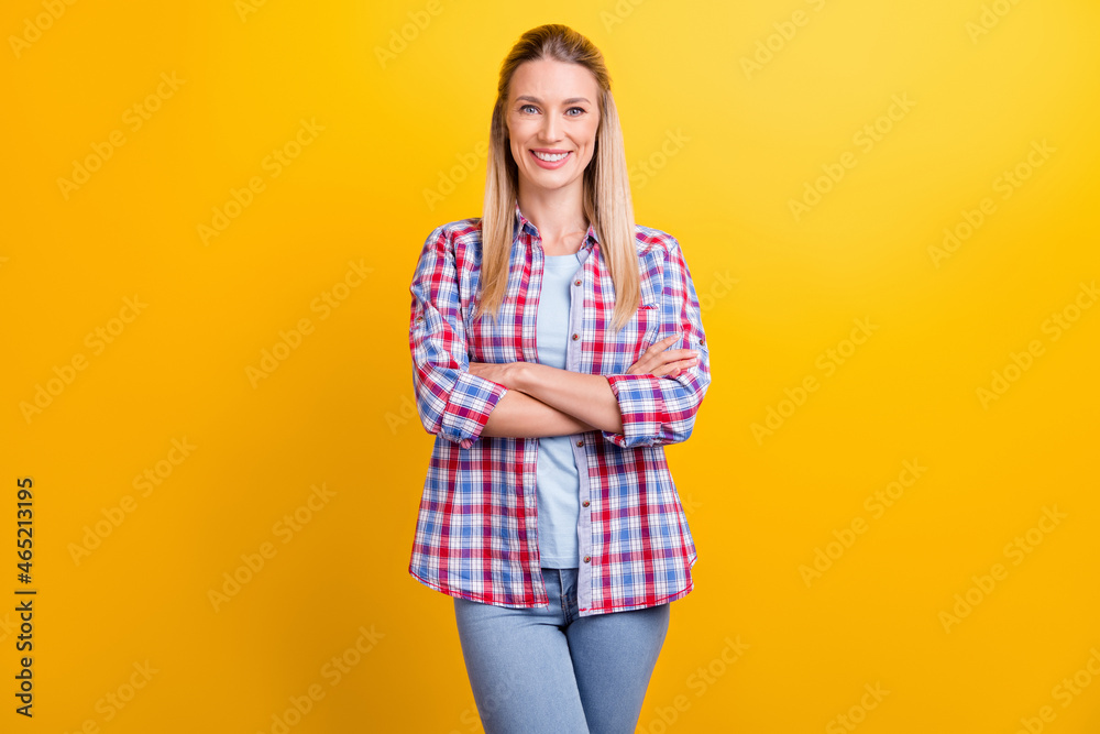 Photo of optimistic blond agent lady crossed arms wear blue shirt isolated on yellow color background