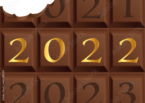 Carte de vœux 2022 avec une tablette de chocolat au lait en partie croquée pour symboliser le plaisir et la gourmandise. photo