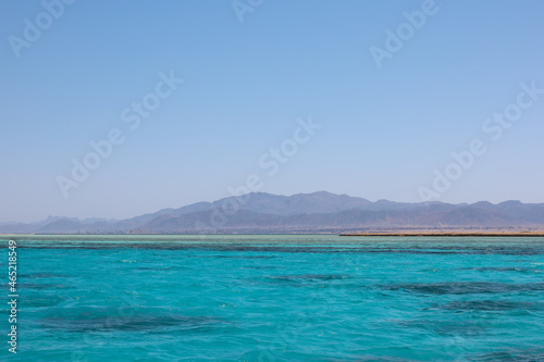 Red sea landscape with clear blue water and mountains and clear sky