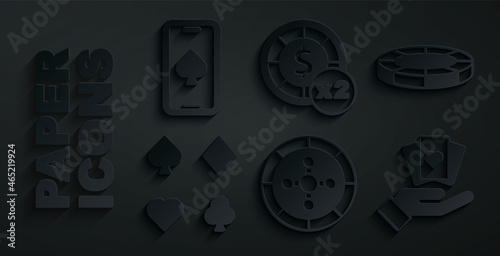 Set Casino roulette wheel, chips, Deck of playing cards, Hand holding, and Online poker table game icon. Vector